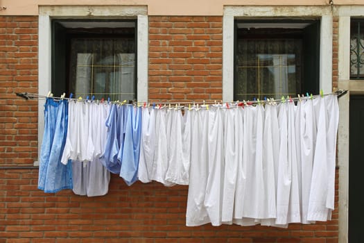 Fresh and clean clothes at window line