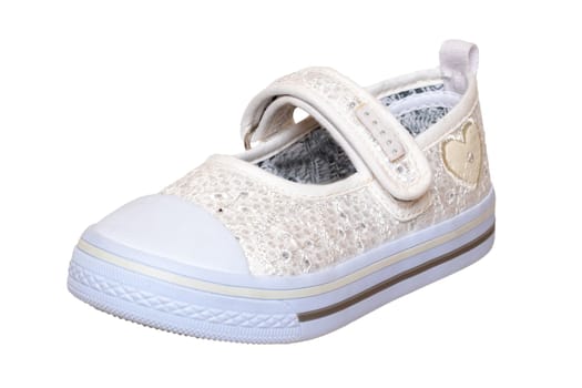 Child shoes fashion. Close-up of a single white beige shoe or sneaker for girls with pearls and heart isolated on a white background. Elegant and trendy shoe fashion for kids. Macro.