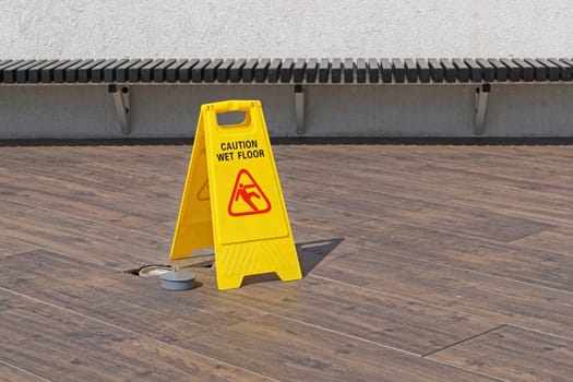 Caution wet floor sign at terrace patio