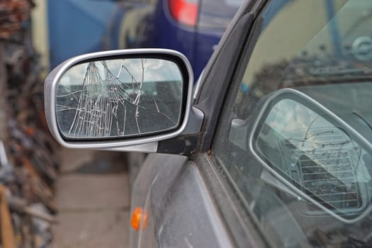 Broken glass at car side mirror damage