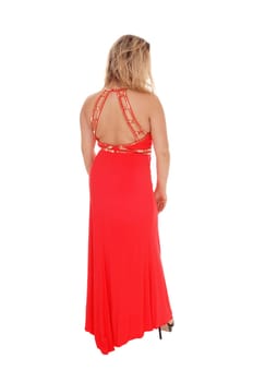 A young blond woman standing in a long evening dress from the back.isolated for white background.