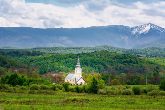 Church in front of Carpathian Mountains in Romania