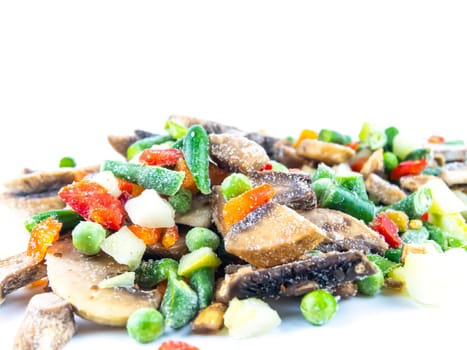 Frozen vegetables on a white background with place for text. Food photo. Vegetable salad. Background image. Free place.
