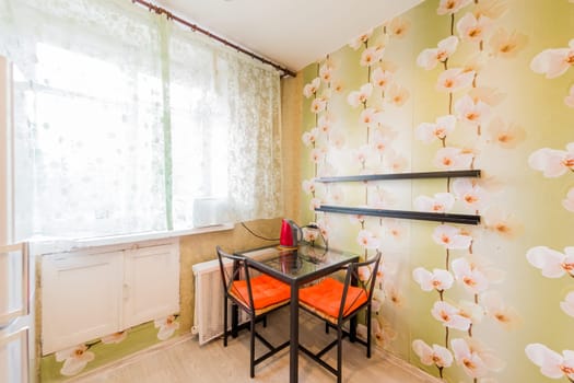 Russia, Omsk- August 02, 2019: interior room apartment. standard repair decoration in hostel. kitchen, dining area