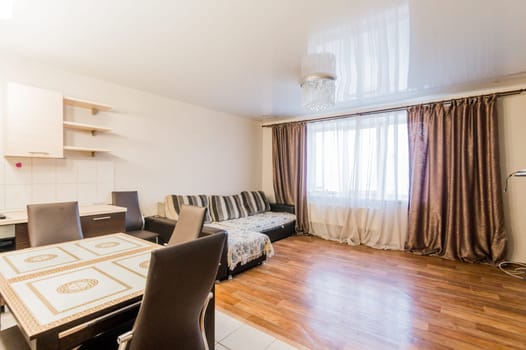 Russia, Omsk- August 02, 2019: interior room apartment. standard repair decoration in hostel. kitchen, dining area
