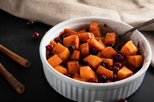 Baked butternut squash and cranberries with honey and cinnamon, just out of the oven.