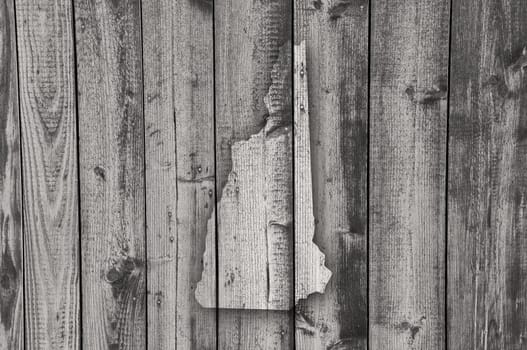 Map of New Hampshire on weathered wood