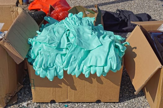 Big bunch of new protection gloves in box