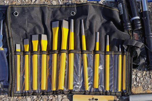 Various sizes of yellow chisels in pouch set