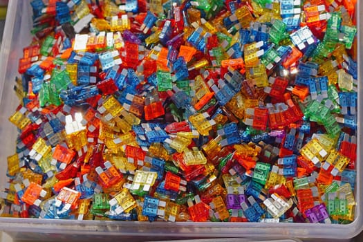 Many color coded fuses for cars in box