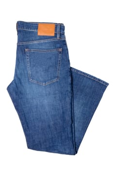 Men jeans isolated. Folded trendy stylish male blue jeans trousers isolated on a white background. Fashionable denim pants for man.