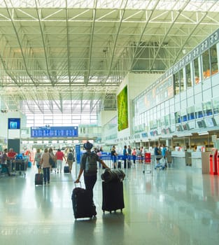 FRANKFURT, GERMANY - AUGUST 29, 2018: People at Frankfurt am Main airport hall. Frankfurt Airport is the busiest airport by passenger traffic in Germany as well as the 4th busiest in Europe