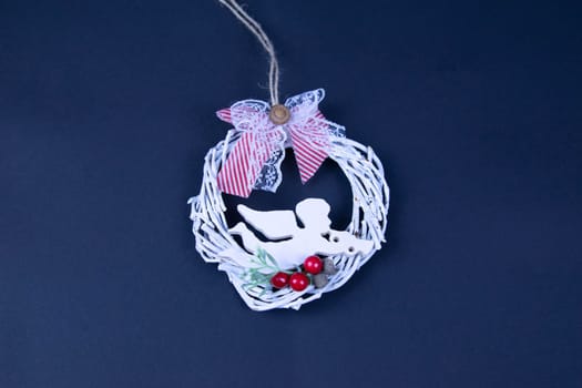 Handmade star decorated with cones and cranberries with christmas deer