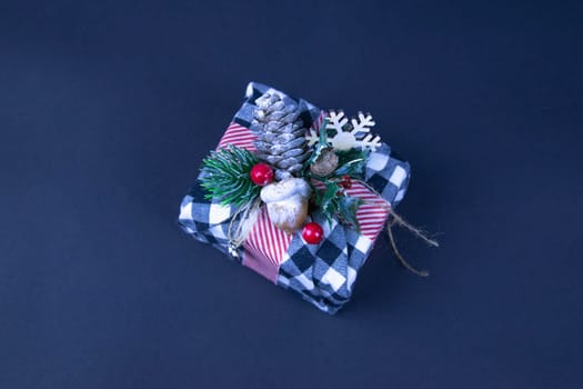 Handmade star decorated with cones and cranberries with christmas deer