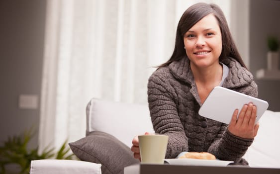 she works and has breakfast on the couch of her living room because she can work at home