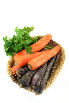 orange and purple carrots against a white background