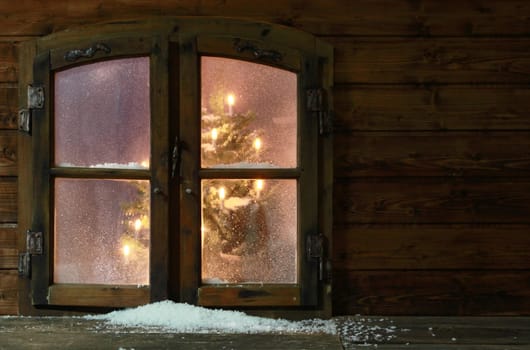 Small Amount of Snow at Vintage Wooden Window Pane with Christmas Lights Inside the House.