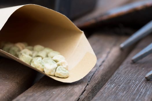 Pea seeds in paper envelope