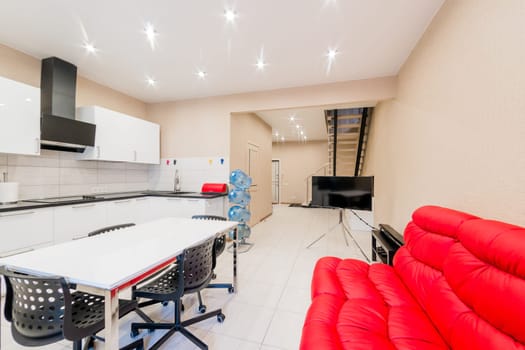 Russia, Moscow- August 05, 2019: interior room apartment modern bright cozy atmosphere. general cleaning, home decoration, preparation of the house for sale. modern kitchen, dining area