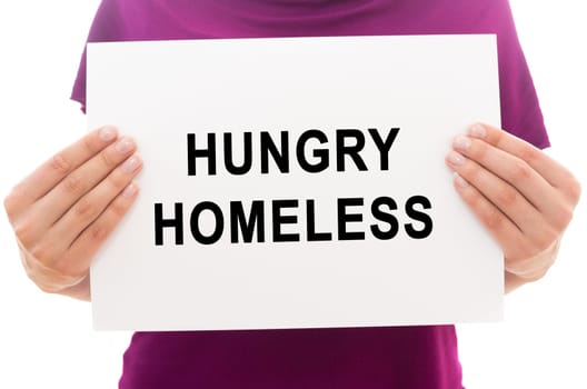 Girl holding white paper sheet with text Hungry homeless