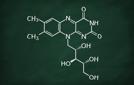 Structural model of Vitamin B2 (Riboflavin) on the blackboard.