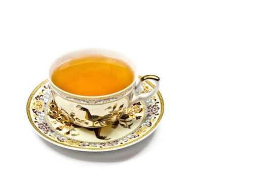 A classic gold-rimmed china teacup and saucer. Isolated on white.