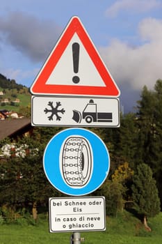 Traffic sign Attention snow plough and snow chains in case of snow