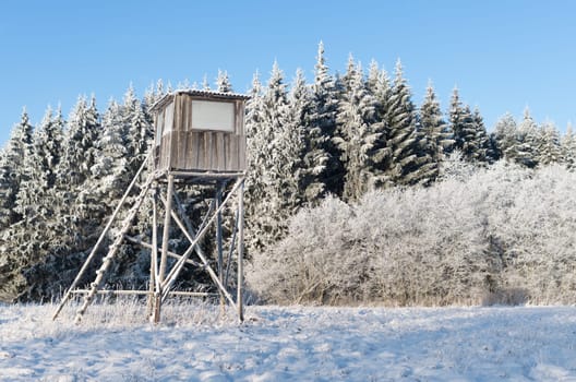Hunting tower in harsh winter in the Lithuanian field