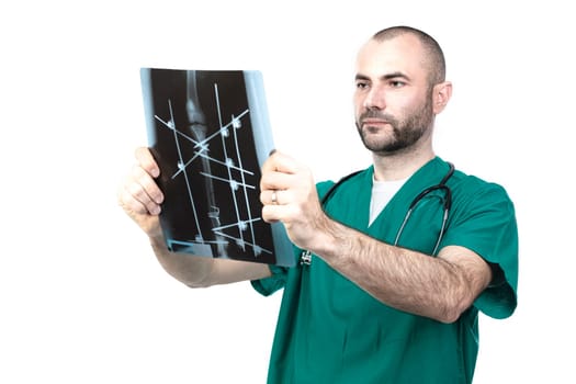 Veteran at work examines an xray of a multiple dog fracture.