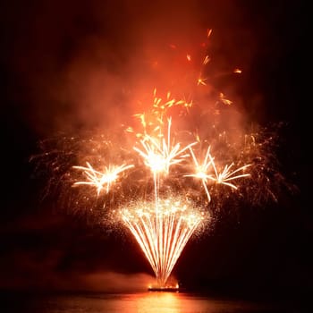 Colorful red fireworks on the black sky background
