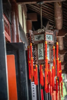 Traditional chinese old lanterns with red threads decorations attached in Wenshu Monastery, Chengdu, China