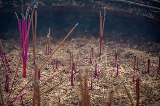 Close up of burning incense sticks in the courtyard of Wenshu Temple, Chengdu, Sichuan Province, China