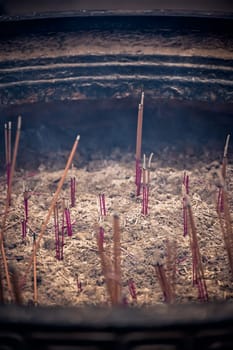 Close up of burning incense sticks in the courtyard of Wenshu Temple, Chengdu, Sichuan Province, China