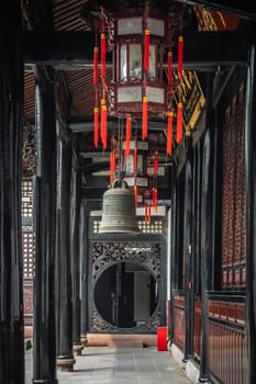Large Brass Bell hanging under the roof in Wenshu Monastery, Chengdu, China