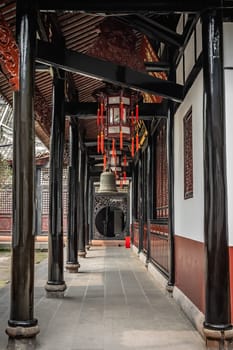 Large Brass Bell hanging under the roof in Wenshu Monastery, Chengdu, China