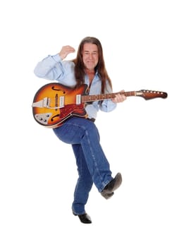 A happy musician dancing with his guitar with his long brunette.hair, singing, isolated for white background.