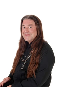 A middle age indigenous man in a portrait picture wearing a black.shirt and jewellery with his long hair, isolated for white background.