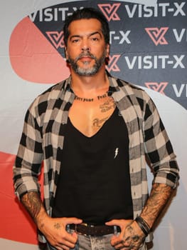 actor and model Aurelio Savina at the erotic fair Venus 2019 in Berlin
