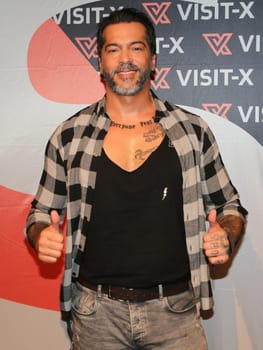 actor and model Aurelio Savina at the erotic fair Venus 2019 in Berlin