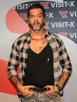 actor and model Aurelio Savina at the erotic fair Venus 2019 in Berlin