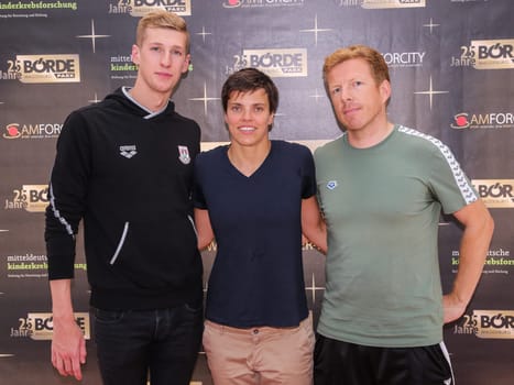 German Swimmer Florian Wellbrock and german swimmer Franziska Hentke and Coach Bernd Beckhahn  ( SC Magdeburg , DSV ) in the action "Pictures of Hope"" in Magdeburg"