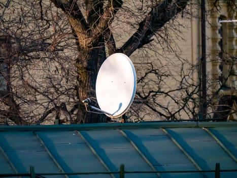 Satellite dish on the roof of the house. Technology. Place for text. Background image.