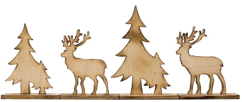 Cut out deer figure made of wood with dark edges and wooden fir trees isolated on white