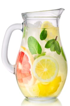 Grapefruit mint pineapple lemon iced drink or lemonade pitcher isolated