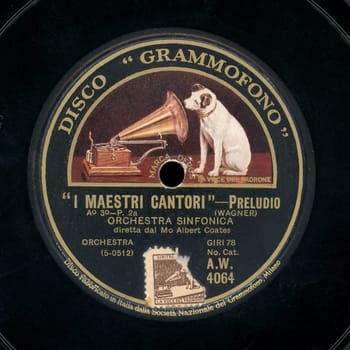 MILAN, ITALY - CIRCA DECEMBER 2019: Vintage 78 rpm shellac disc of La Voce del Padrone (translation:  His Master's Voice) record label