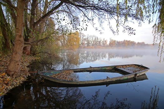 Idyll with boat on the shores of Lake Erlichsee