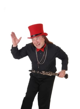 A indigenous man in a black shirt and pants and red hat dancing with.his clarinet in his hand, isolated for white background.