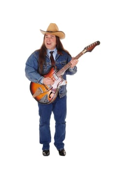 A handsome indigenous man in a jeans jacket, pants and a cowboy hat.standing and playing the guitar, isolated for white background.