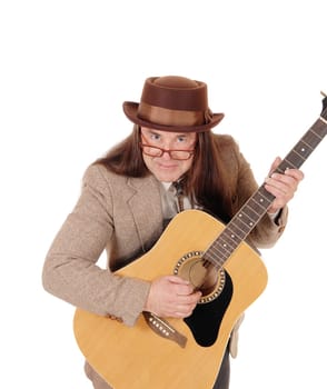 A middle age man sitting in a brown jacket and hat, wearing glasses.and holding his beloved guitar, isolated for white background.