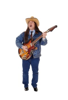 A handsome indigenous man in a jeans jacket, pants and a cowboy hat.standing and playing the guitar, isolated for white background.